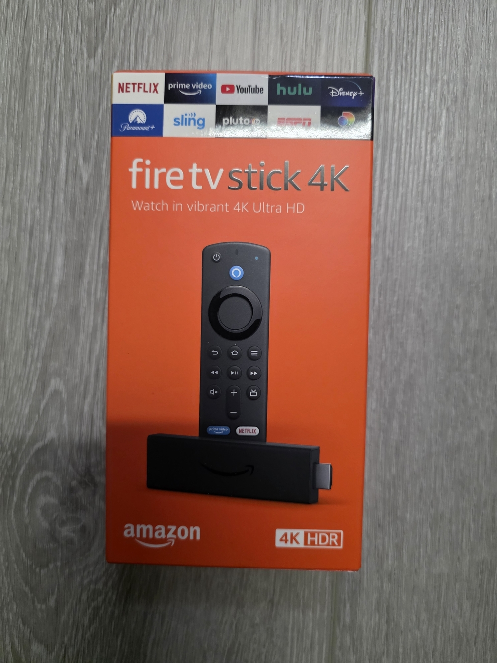 Amazon Fire TV Stick 4K - Orange Box with Black Stick and Remote